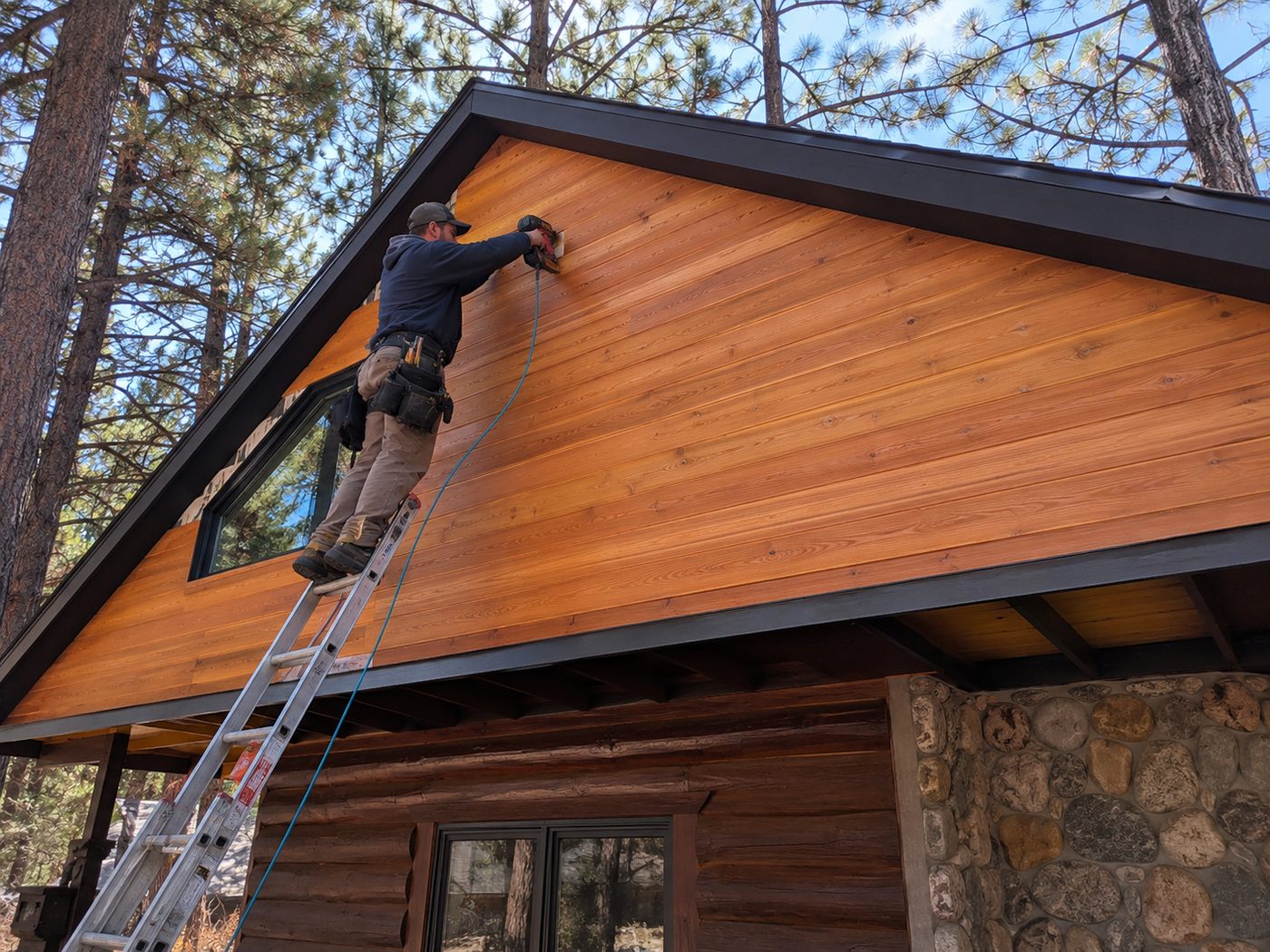 Freshly stained cedar tongue-and-groove facade on a Big Bear cabin