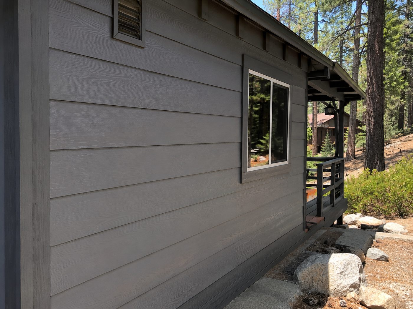 Repaired and repainted cabin siding blended seamlessly in Big Bear